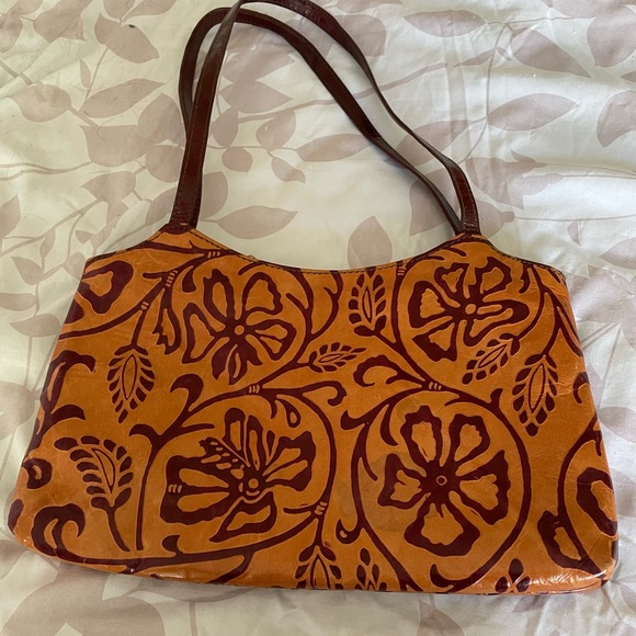 Handbags - NWOT all leather shoulder bag. Orange w/deep red design